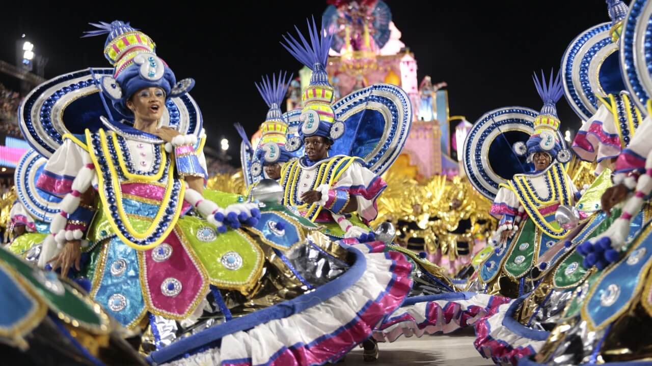 Cheerful people parading in a samba school costume - Rio Carnival